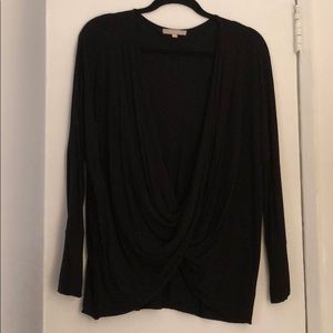 Black draped top. Wear with black cami.